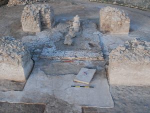 <p>Fig. 5. The chāhār-tāq from the south with mud-brick impressions left on the surrounding area. A stone slab is seen on the floor (photo: Y. Moradi).</p>
