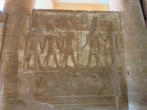 <p>Fig. 8. Darius “being led to the sanctuary” by Up-wawet of the south and Khnum into a hall to be received by Amenebis and Udo, who “give him all lands.” South jamb of the gateway to Darius’ Temple (image: R. Rollinger).</p>
