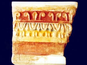 <p>Fig. 19. Qal’eh Zohāk. Part of a column capital decorated with polychrome motifs (photo: Hasan Derakhshi).</p>
