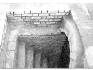 <p>Fig. 4. Entrance to the tomb with the stairway leading down to the vaulted tomb chamber. Note that the upper courses of bricks have been restored (after Rahbar, “Ārāmgāh-e zirzamini-ye elymā’i dar Sāleh Dāvood,” p. 297, pl. 10).</p>
