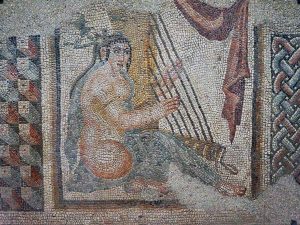 <p>Fig. 16. The mosaic panel depicting a woman playing harp from the Eyvān with mosaics, now in the Louvre Museum (photo: Pierre André Leclercq, Creative Commons, licensed under CC BY-SA 4.0, <a href=